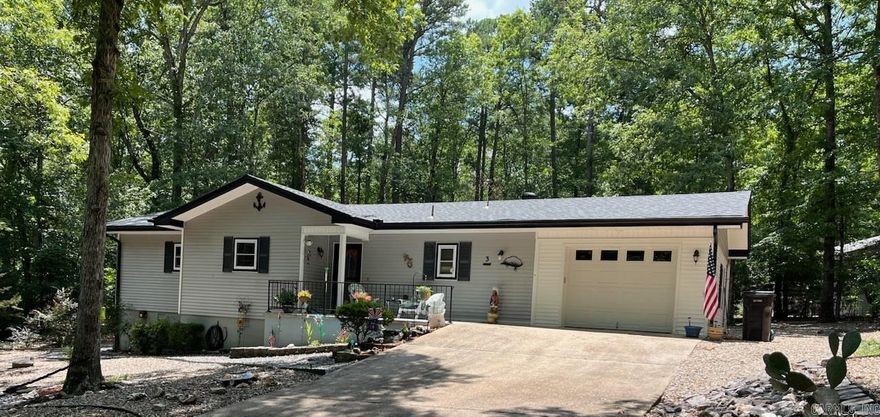 You will fall in love with this adorable 2-bedroom 2 bath home with numerous updates. Newer roof in 2023 (sunroom roof in 2019), Wilson windows in sunroom in 2018.  Kitchen remodeled with maple cabinetry with pull out drawers, tile flooring, stainless appliances (stove in 2022 & dishwasher in 2018) and granite counters.  Primary bedroom has walkin closet and remodeled bath with beautiful shower. Living room features ventless propane stove with fire rated faux brick wall behind.  Nice size dining room perfect for entertaining and opens to sunroom.  Newer Lenox heat pump, new ceiling fans in 2020, hot water heater in 2019, interior freshly painted in 2022, front porch patio replaced in 2024, new Gutter Balster screens in 2023.  Crawl had mold remediation in 2023. LVP flooring in primary bedroom, living and dining, sunroom. Saferoom/storage in adjacent to garage.    Hot Springs Village is a 26,000 gated community in the Ouachita Mountains with 9 golf courses, 11 lakes, pickle ball, tennis, 40 miles of walking trails, indoor and outdoor pools PLUS beautiful white sane beach with playground, volleyball, fishing and picnic area.  One time $1500 buy in for new homeowners . OCCUPANCY 10/28