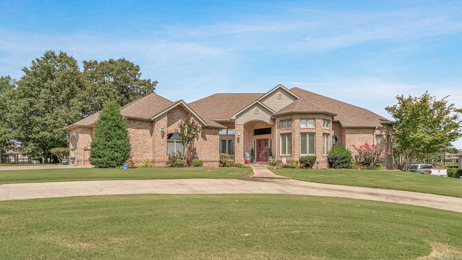 Welcome to 2911 Ridgepointe Blvd. in Jonesboro, AR. This stunning single-level, all-brick home boasts 3 bedrooms and 2.5 baths on a spacious 1.01-acre lot overlooking the beautiful Ridgepointe Country Club golf course. Features include a large covered patio with picturesque views, 3 gas log fireplaces, a formal dining room, a breakfast area, and tall ceilings. The home also offers a 3-car attached garage, a storm cellar, an irrigation system, and upscale appliances. Recent upgrades include a new roof, HVAC systems, and water heaters within the past 3 years. An office space completes this exquisite property. This home is located in the Valley View school district. Showings by appointment only. Give us a call today to schedule your viewing!