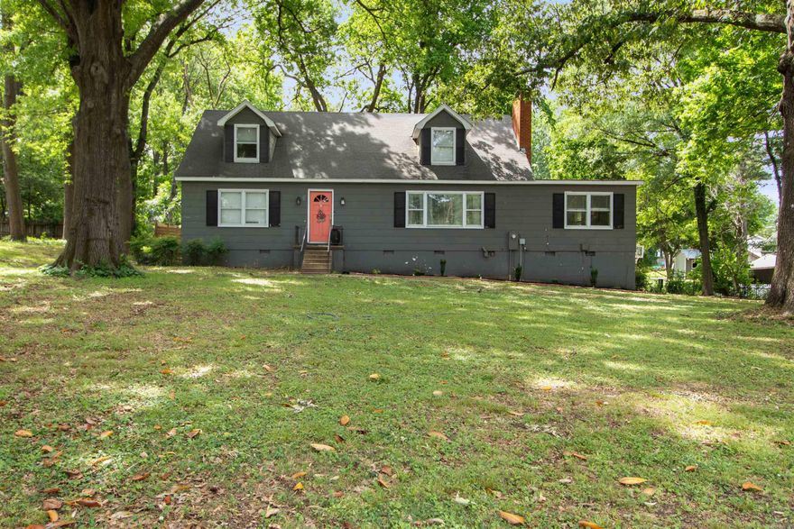 Welcome to the market! Nestled on a beautiful wooded lot in the heart of central Jonesboro, this spacious 4 bedroom, 2 bathroom home offers 2,240 sq ft of character, charm, and versatility. Situated on approximately .46 acres, the property is surrounded by mature trees creating a peaceful setting while still being conveniently located near everything downtown Jonesboro has to offer. Inside, you'll find multiple living spaces including a formal living room featuring a cozy fireplace and an additional den perfect for a second living area, game room, office space, or entertaining guests. The layout provides plenty of room for both everyday living and hosting family and friends. With its combination of space, location, and wooded privacy, this home is full of potential and ready for its next owner to make it their own! Call your favorite Realtor to setup a time to look at this home today.