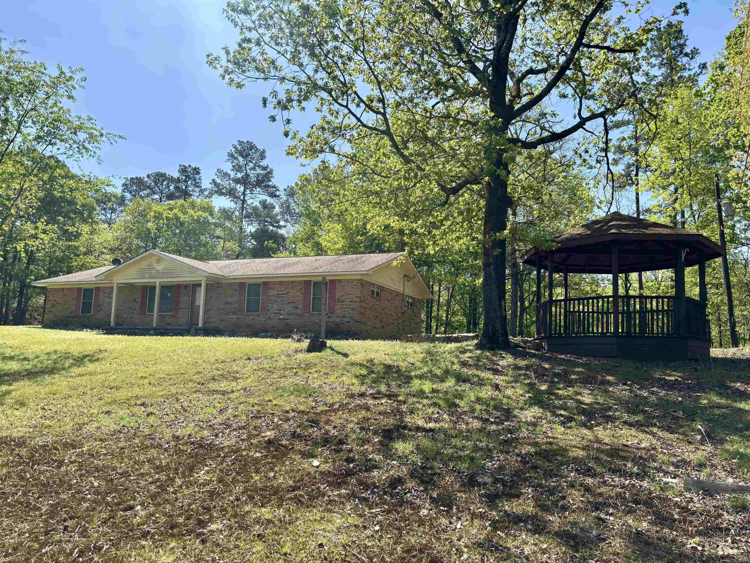 Foreclosure property. This 3-bedroom, 2-bath brick home sits on approximately 1 acre and offers 1,513± sq ft of living space. Features include a functional layout, attached garage, woodburning stove, and an outdoor gazeboāideal for relaxing or adding a hot tub. Property will be transferred by Special Warranty Deed and sold "AS-IS, WHERE IS" in its present condition. Arvest employees, directors, and their family members are not eligible to purchase Arvest-owned properties.