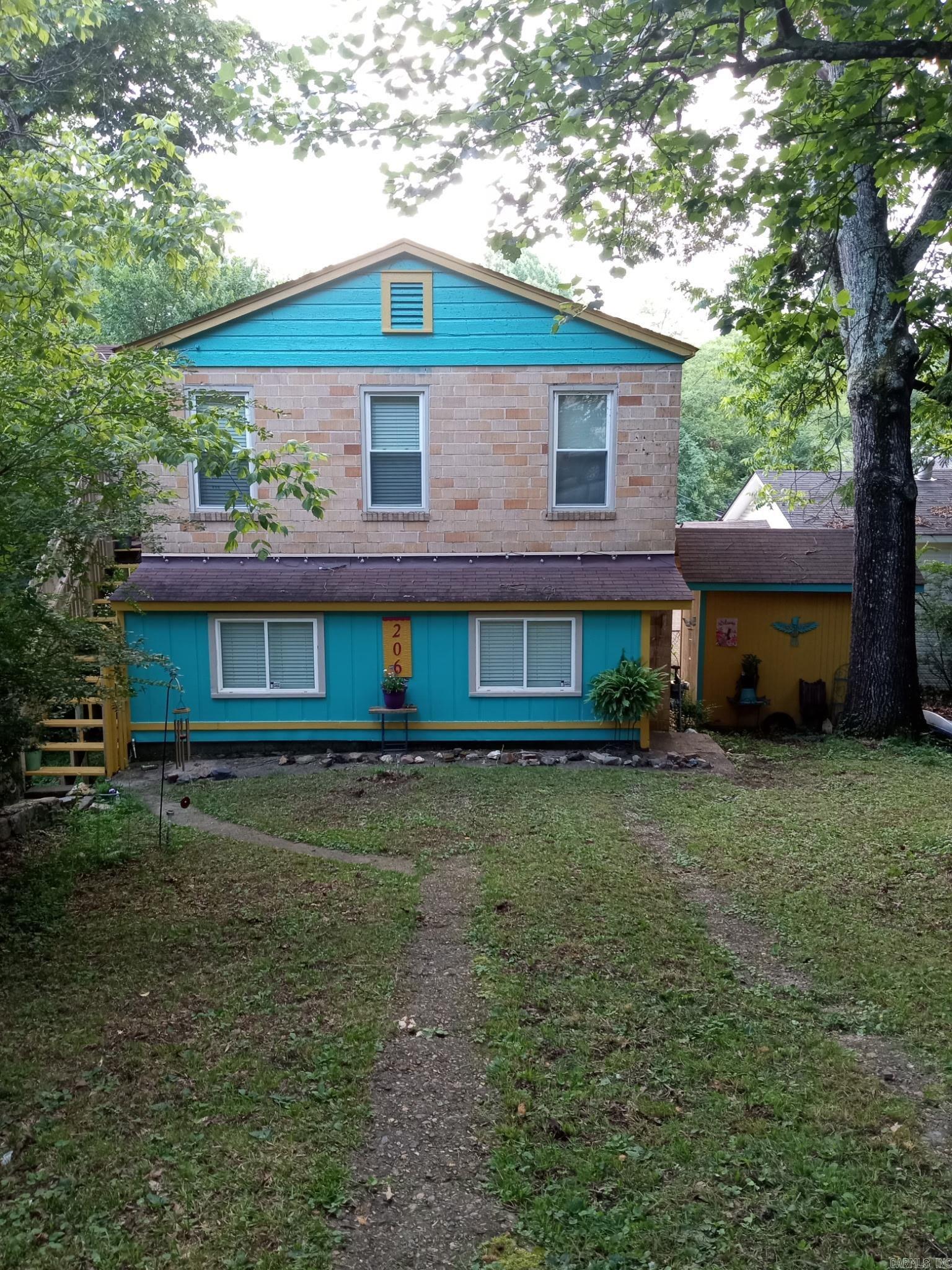 Do you want to live in a treehouse? Check out this one of a kind, well maintained home! It has a screened-in balcony, treetop views, outdoor storage, is walking distance from the Pullman trailhead and in a prime location for visiting downtown hot springs - while also providing tons of quiet privacy. The house is very close to Rick's Pond, DeSoto Park, Gulpha Gorge and so much more! It has a newer roof, updated plumbing, new electrical panel and other items were serviced recently such as the hot water heater, dryer, roof vent and faucets. This is a highly motivated seller. Bring all offers! The trees have been trimmed and it's ready for you to move in! All of the appliances convey.