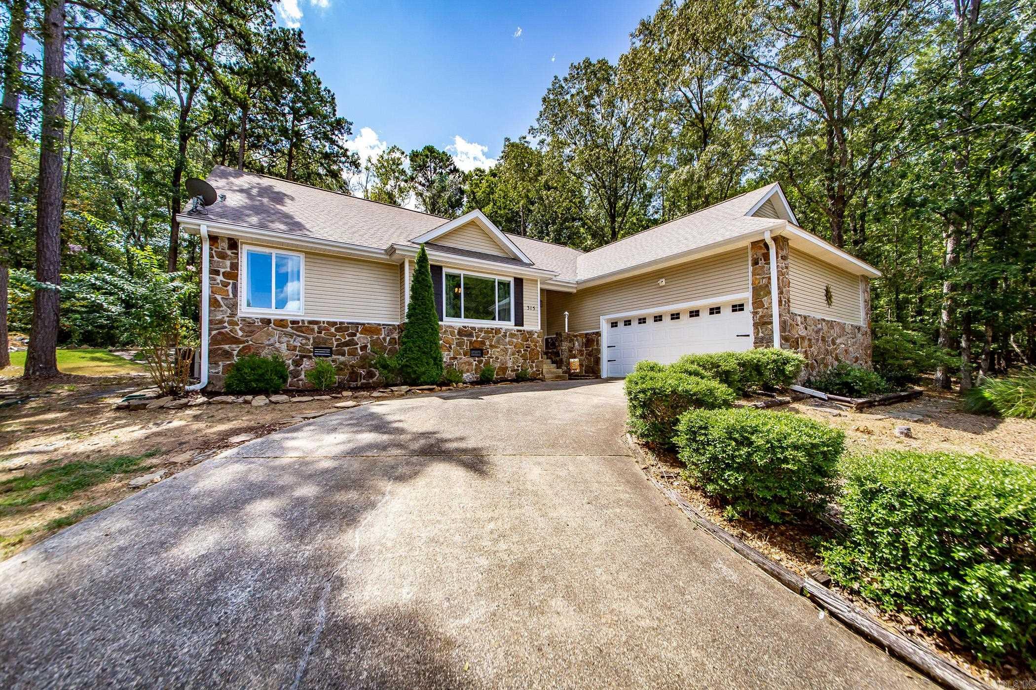 Golf Course Frontage on all 4 lots that also provide plenty of privacy with buffer lots on both sides of the home! Sellers are moving back to their hometown in North Carolina to be closer to family. These have been replatted into one large tract with 1.03 acres & only one set of dues which is $218.85 per month which includes insurance on the city sewer grinder pump, tennis courts, pickle ball courts, 3 swimming pools (Mountain Ranch, Cool Pool, & Hamilton Cove Pool), ATV Trails, Hiking & Biking Trails, Playground, & Picnic Pavillion. This home has new flooring, new paint, Primary Bathroom has been completely remodeled with river stone flooring, new jacuzzi tub, walk in shower, new vanity & reconfigured walk in closet. Sellers have had licensed contractor do some extensive work on the drainage flow in the backyard & on the sides of the home so new french drains etc. plus new back deck,extended patio, outdoor lighting in the trees, & property backs right up to hole 18 of the Mountain Ranch Golf Course. Oversized garage for two vehicles with a nice size storage room with Stand up Freezer that will stay. Washer, Dryer, Refrigerator, microwave, dishwasher, & oven all stay too.
