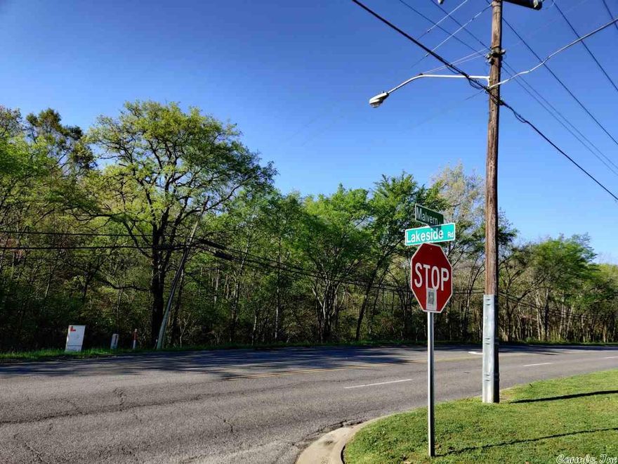 Our remarkable 8.11 acre parcel, located on Malvern Rd directly across from Lakeside School, is truly a diamond in the rough. It's an amazing 1414 feet of highway frontage, and a depth of 255 feet. Perfectly located near everything Hot Springs has to offer. It's currently zoned R-1 and R-2, any other non-residential development will require approval from the city zoning and planning. Check it out today, you won't find another property like it!