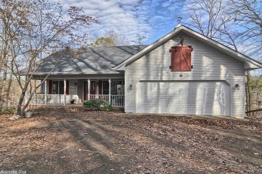 Very nice home on Lake Desoto. 3 bedrooms, 2 baths, in excellent condition. Move-in ready.  Near west gate amenities.  Hot tub/whirlpool on deck overlooking the lake. Very nice, waterfront home, at a very attractive price. Approx. 170' water frontage. 11 X 14 Arkansas Room. Laundry room and pantry. Large two car garage. Gutter guards. New heat pump 2008. 15' X 57' workshop/storage below.