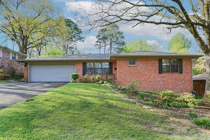 Superb one-story brick residence with a BRAND NEW ROOF and a two-car garage is located in a prime midtown area near shopping, dining, and hospitals! This charming property includes two bedroom (each with its private bathroom and generous closet space), a cozy den, and a combined living/dining room with original hardwood floors. The spacious kitchen features an island, double ovens, and a large walk-in pantry. Outside, there is a delightful covered brick patio for relaxation or entertaining guests and a beautiful fully fenced backyard! This one has it all! Agents see remarks.