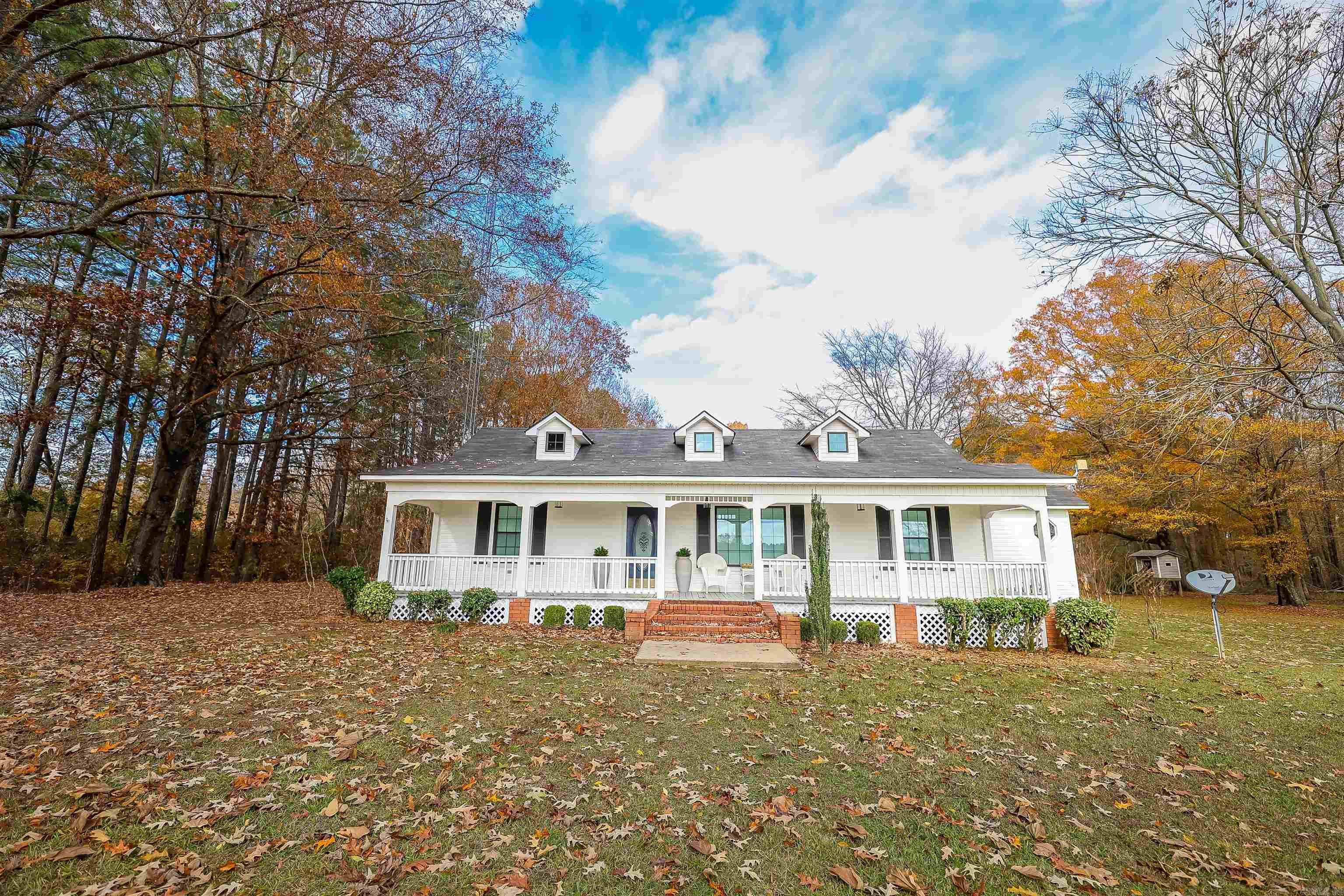 Country charm awaits you in this well-built Harmony Grove home! Enjoy being tucked away at the end of a 1/4 mile driveway.  An open concept layout between the beautifully updated kitchen and living room invites conversation and a feel of connection.  Updated flooring, Wilson brand windows, primary bathroom, and much more have been thoughtfully added.  Don't miss the extra features including a detached apartment/office with built-in storage and 1/2 bath, outside covered patio with grilling area, and a spacious 3-car garage. Sitting on 20+ acres, you'll have the versatility and privacy that living outside of city limits provides complete with barn and spring-fed pond.   If this home checks off the boxes, make your appointment while this rare find is available!