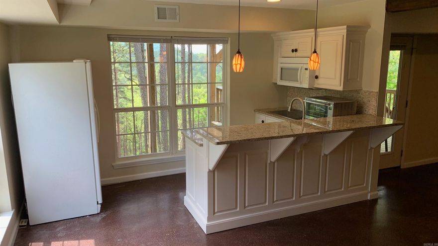 All Utilities Included! 800 SF studio / efficiency apartment in a single family home walk-out basement with a private entrance. Newly remodeled kitchen area with Granite counter tops and under mounted sink. Private entrance, private deck area, lots of windows with views into private wooded area. Quiet secluded neighborhood with large lots.  Includes refrigerator, microwave, range top, washer/dryer, 1 full bath, stained cement floors throughout, lots of storage space, and all utilities, unfurnished.  1 year lease required. Edge of West Little Rock and Roland, 1 mile from Pinnacle Mountain. Within 1 mile of Walmart on Cantrell and Chenal.  Apartment has a free standing portable air conditioner/heater and dehumidifier to heat and cool the entire space. Parking is on street for resident and guests.  It is a basement apartment... We live upstairs and have kids. We are pretty quiet between 7pm and 6:30am. We're looking for someone that is quiet as well.  This property is owned by a licensed real estate agent in the state of Arkansas, with license held at TKP Management, LLC.