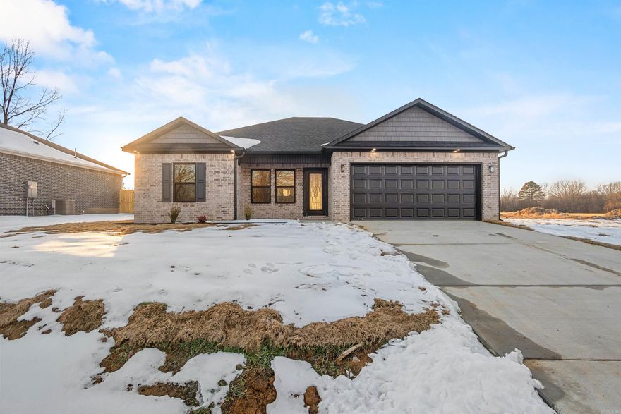 PRICE IMPROVEMENT $219,900 with up to $3,000 towards closing costs at closing. 3bed/2bath open/split floor plan, vaulted ceiling living area. Slow closed cabinetry. Quartz kitchen countertops. All appliances **BONUS** side by side refrigerator. Double marble vanities.  Master walk in rain head marble shower with matching marble tub. Black fixtures & fittings. Luxury vinyl flooring throughout.  Remote ceiling fans. Above garage storage with a partial floored attic. To complete checking all the boxes the porch and patio are trimmed with tongue-and-groove Nordic spruce ceilings.  Use of photocell exterior lighting. Fully fenced backyard. 2/10 Home Warranty.