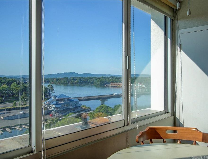 8th-Floor Furnished Lakefront Condo with Lake Hamilton & Mountain Views | Beacon Manor  Take in beautiful views of Lake Hamilton and the surrounding mountains from this 8th-floor lakefront condo in Beacon Manor. Located in a gated community, this unit offers both privacy and convenience, making it well suited for a short-term rental, vacation getaway, or full-time residence.  The spacious bedroom features custom built-ins, providing excellent storage along with a cozy sitting area positioned to enjoy the views. The layout offers comfortable living with the flexibility today’s buyers are looking for.  Beacon Manor is a sought-after lakefront condo complex known for its amenities, including a swimming pool, tennis courts, game room, party room, and on-site laundry facilities. Whether relaxing by the water or entertaining guests, everything you need is right on site.  Ideal for buyers seeking a Lake Hamilton condo, an income-producing investment, or a low-maintenance waterfront home, this property delivers location, views, and lifestyle in one desirable package.