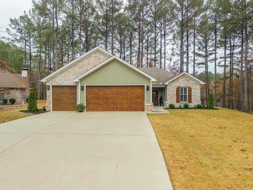 Welcome to this 3 bedroom, 2 bathroom home that is close to all the amenities of the East side of the village, but has a partially wooded lot for privacy. This home is move in ready and the sellers have made it a perfect retreat with a hot tub and firepit area that will convey with the house. The spacious garage is an added bonus as well for extra storage or a golf cart. One time buy in fee applies for new village residents.