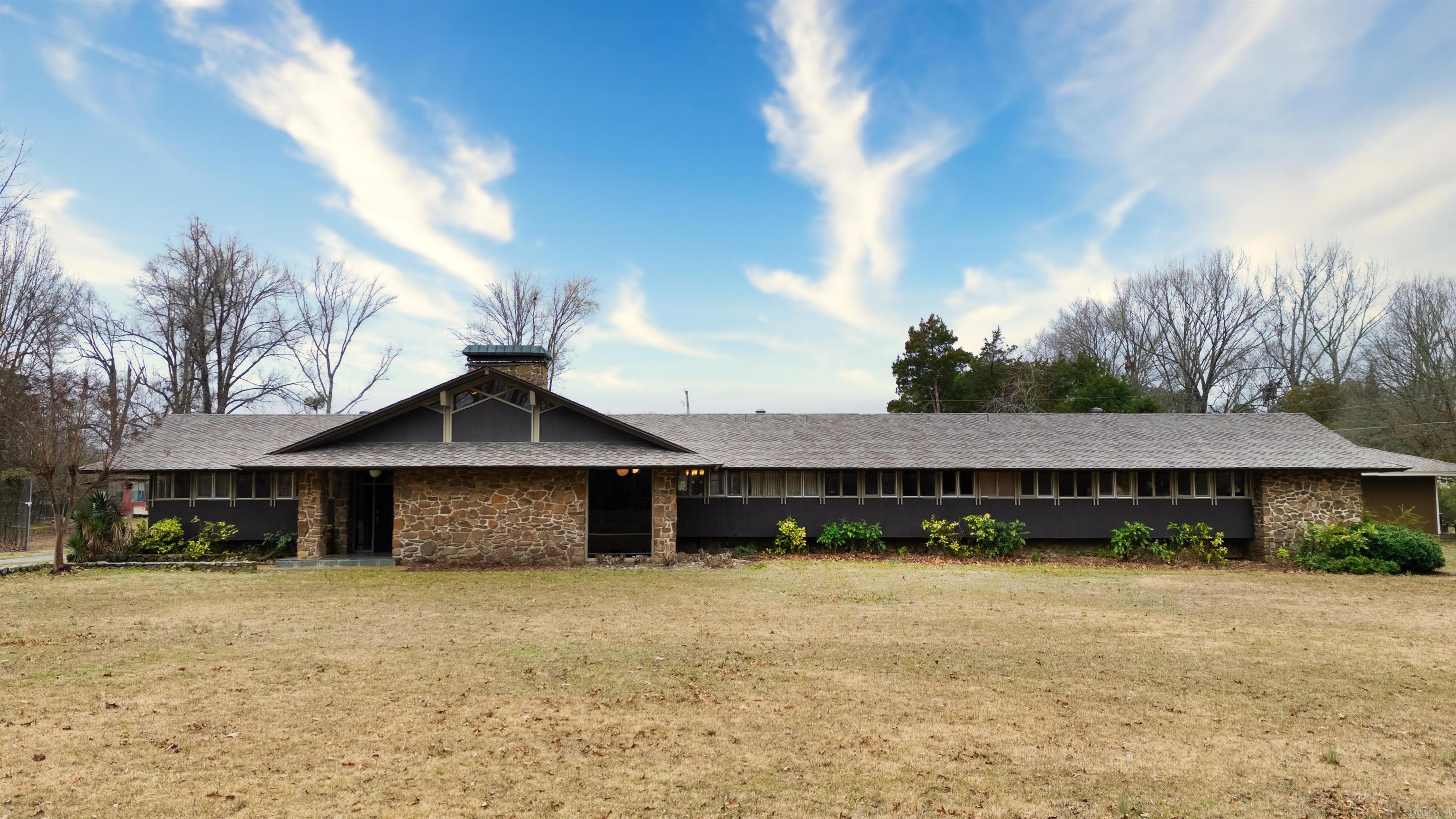 Explore this stunning one-level mid-century home nestled on 9.3 acres in the heart of Cabot. The property also includes a 1,213 sq ft guest house, just 11 years old, perfect for in-law quarters or rental opportunities. The expansive grounds feature a hydroponic greenhouse, a pickleball court, and a basketball court. Inside, the kitchen boasts elegant quartz countertops and modern conveniences like an ice maker and trash compactor. Other standout features include beautiful hardwood floors, stained glass doors, vaulted ceilings, and striking rock walls. Donāt miss the chance to experience the unique charm of this exceptional property.