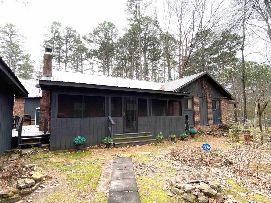 PRICE REDUCED!!! Make this your perfect getaway for the lake. This property has 4 bedrooms and 3 baths total.  Main house 3 bedrooms, 2 baths, living room, kitchen and laundry (1475 SF).  The guest apartment above the garage has an additional 800SF with 1 bedroom, 1 bath and living area with 1 car garage below and workshop.  This would be perfect for guests or rented out for additional income.  There is a detached 2 car garage with more additional storage rooms/shops attached.  Fenced in yard for your pets.  Walking distance to the lake with access off Lake Forest Estates.  This area is just minutes to Old Hwy 25 boat launch and rec area.  Lots to see and make this property your own!!