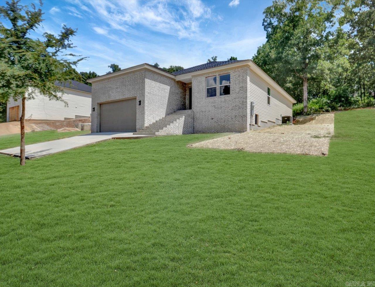 Brand New Construction in Hot Springs! Located at 312 Columbia Hills Street, this 3-bedroom, 2-bath home offers 1,600 sq ft of thoughtfully designed living space. The open-concept layout seamlessly connects the living, dining, and kitchen areasāperfect for everyday living and entertaining. The kitchen features modern finishes and ample storage. Additional highlights include a two-car garage, quality construction, and beautiful interior details throughout. Move-in ready and conveniently locatedādonāt miss this opportunity!
