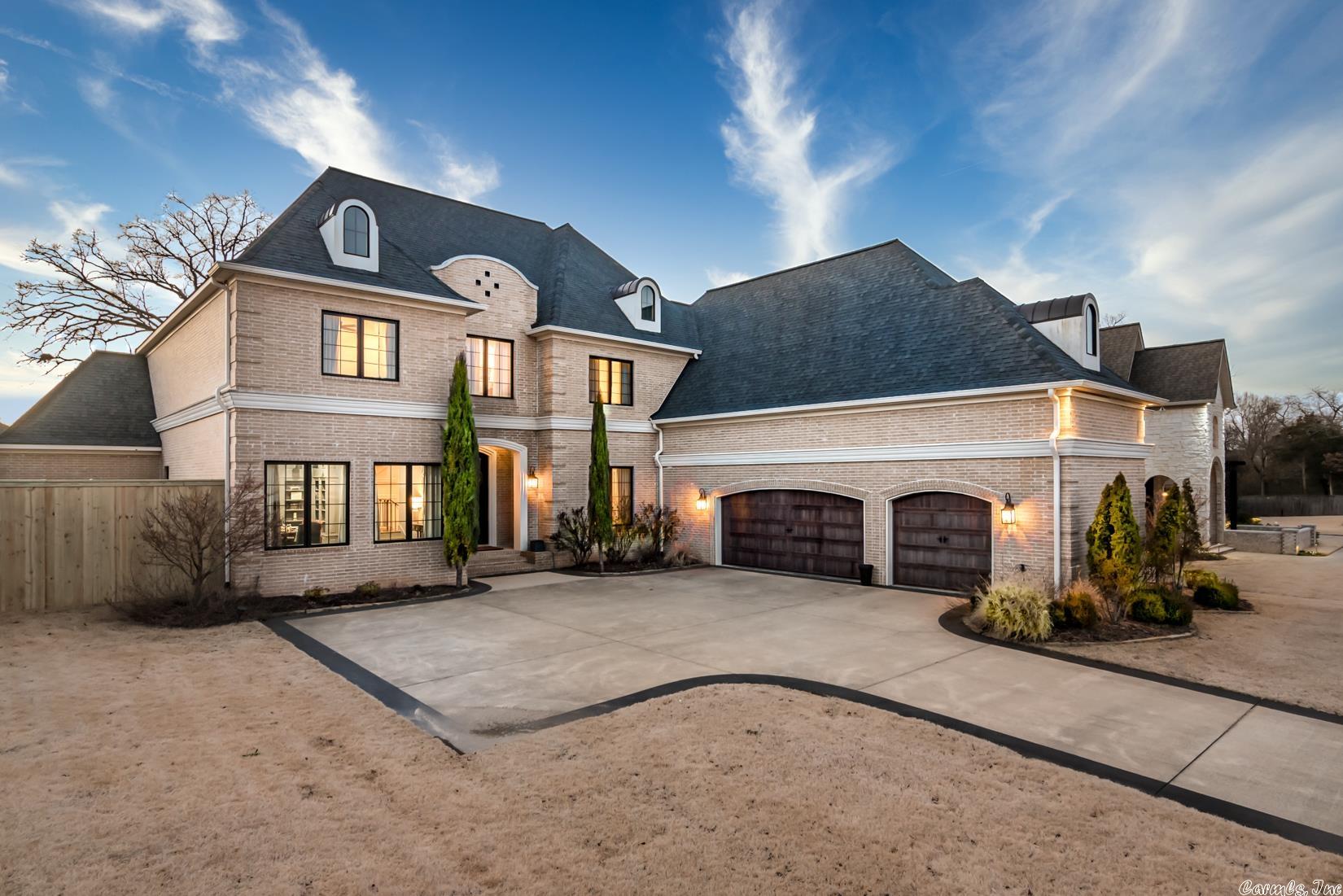 Welcome to this stunning luxury home with custom finishes nestled in the exclusive, gated neighborhood of Bella Rosa Estates. Enter through iron doors into an incredible two-story foyer with byzantine ceiling, iron railing staircase and site finished hardwood floors. The great room opens to the gourmet kitchen featuring two spacious islands, a 48" Thermador Range with double ovens and griddle, new Quartz countertops and backsplash, touchless faucet and glass rinser. A secondary prep kitchen is located adjacent to the kitchen. The fabulous floor plan features four bedrooms all with en-suite bathrooms and large walk-in closets. Main level offers both primary and guest suite. The primary suite features access to the covered porch and luxury bathroom with soaking tub and large walk-in shower! The second level features a media room with a full wet bar, ice maker, and surround sound. Spacious outdoor covered back porch with flat top grill, marble counters and outdoor fireplace with draperies and custom mantle. See agent remarks.