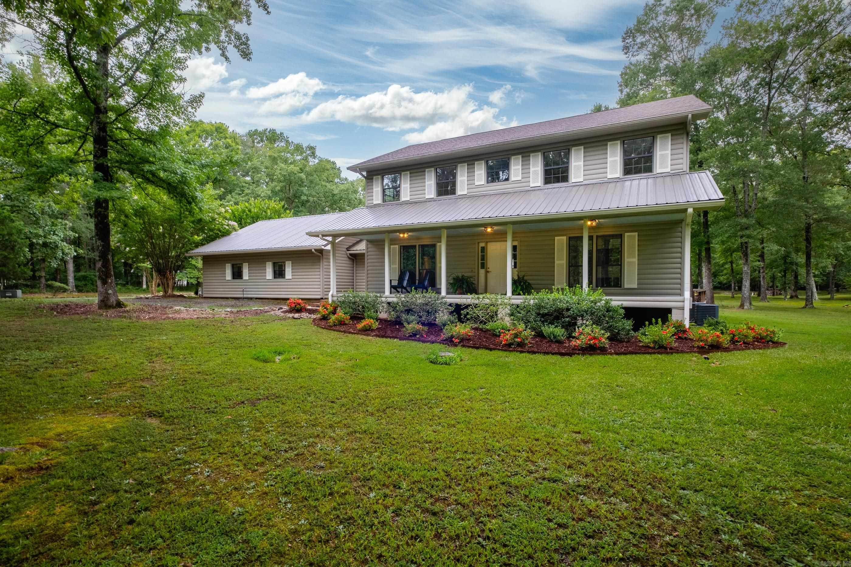 A Rare Find: Level 5-Acre Estate with Pond, MIL Quarters, Shop & More! Welcome to your dream retreat! Situated on 5 flat, usable acres with a peaceful pond, this one-of-a-kind property offers a perfect mix of comfort, functionality, and privacy. The home features 5 spacious bedrooms and 3.5 bathrooms with an open floor plan ideal for modern living and entertaining. All new interior paint and brand-new carpet give the home a fresh, move-in-ready feel, while custom built-ins and a large walk-in pantry with handcrafted cabinetry add style and convenience. Even betterā2 brand-new HVAC systems with a 10-year warranty ensure comfort and peace of mind for years to come. One of the standout features is the attached 900 sq ft MIL quarters, with a full kitchen, perfect for extended family or guests with tons of storage space above. For hobbyists or anyone needing extra space, the property features a 2-car garage/shop, a separate storage building, and ample storage in two attics plus additional space beneath the home. And for added peace of mind, thereās a dedicated storm shelter. This updated and versatile estate is just minutes from everything you need. Schedule a showing today