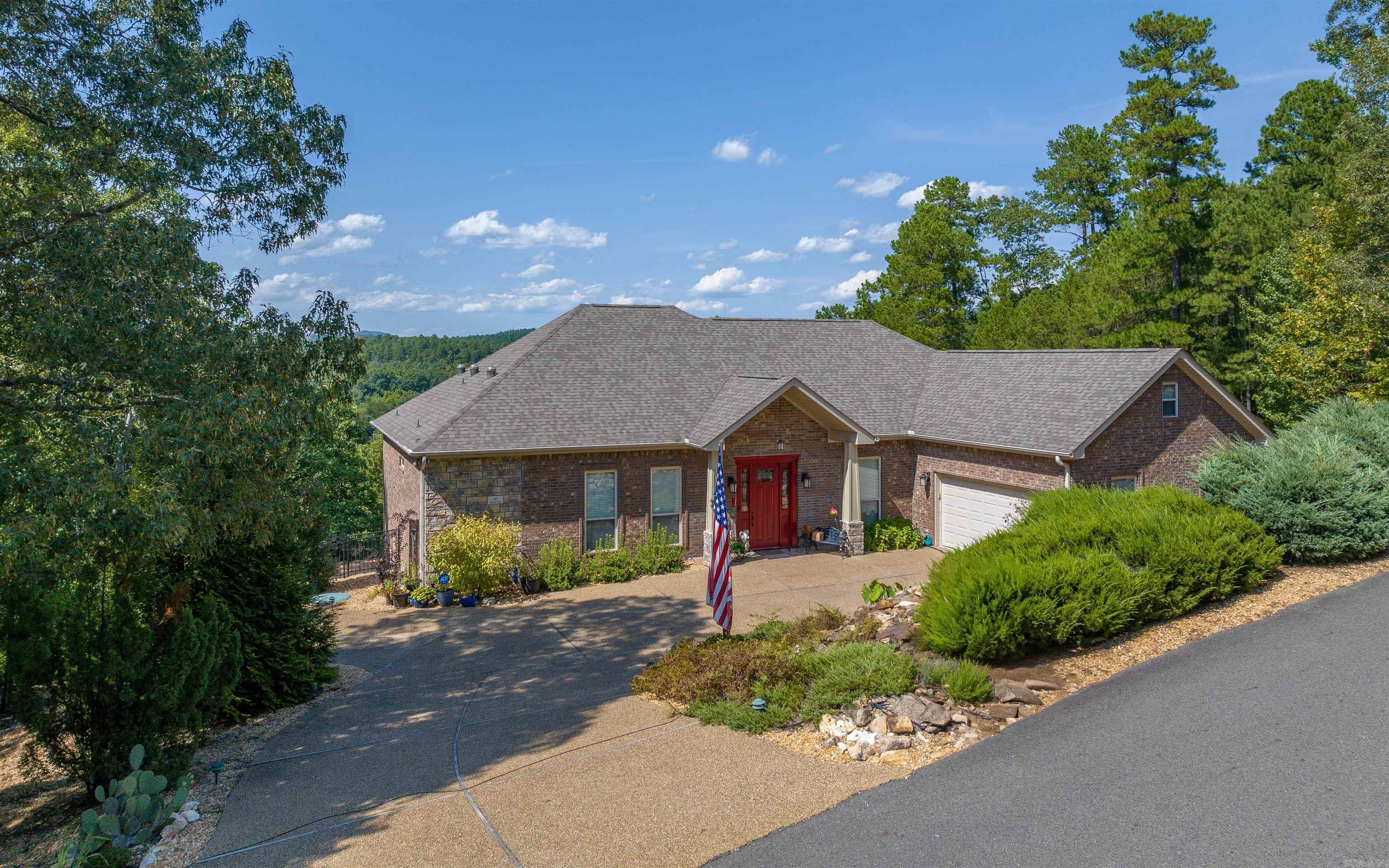 This beautifully maintained homes offers over 2800 sq.ft of living space all on one floor! Current owner added over 400 sq.ft. of living with a wood burning fp to the original plan, now offering 2 family room spaces! Enjoy breathtaking mountain views for miles through expansive picturesque windows that flood the home with natural light. The eat in kitchen is a chef's delight with a gas cooktop, fp and generous dining space for casual meals or entertaining. The deluxe master suite feels like a private spa, offering dual vanities, individual toilets and closets and a shared large tub and shower-a rare layout that ensure both privacy and convenience. Beautiful hardwood floors and tile flow seamlessly throughout the homes, complement its thoughtful design. Outdoors, multiple patios provide the perfect setting to entertain, relax or simply take in the incredible views.