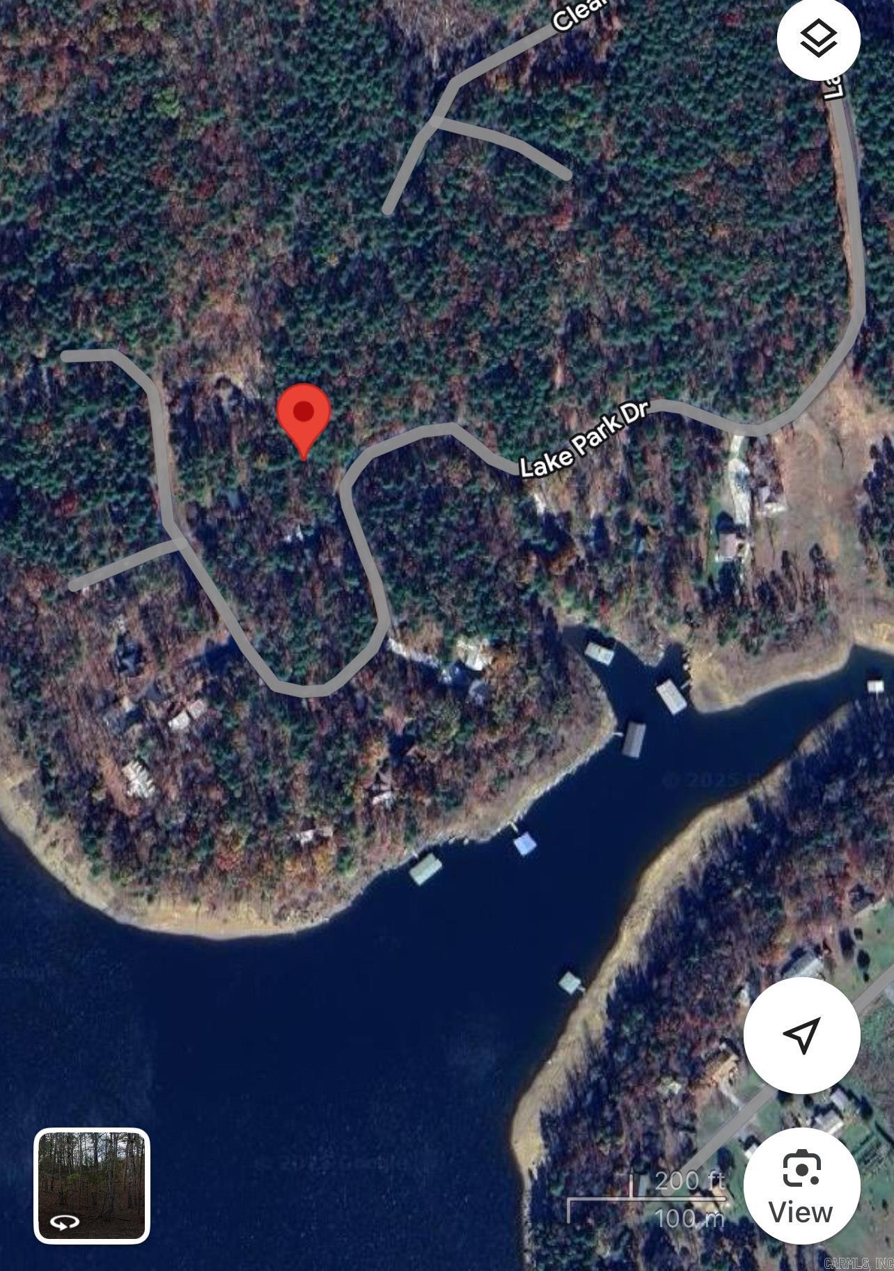 Wooded Lot less than a 1/2 mile to Circle Acres concrete Boat ramp with parking spaces at ramp for boat and trailers. ALSO,90+ miles of ATV trails up the road. Minimum of 1,200 sq.ft. to build. No mobiles allowed.The Cabins & Lakehouses in the area provide that lake feel people are looking for.Majority of the homes are weekenders in the area & a few full time as well.Only 7.6 miles to the town of Greers Ferry, only 3.4 miles to Indian Hills Golf Course, & FFB also has miles of Mountain Bike Trails .