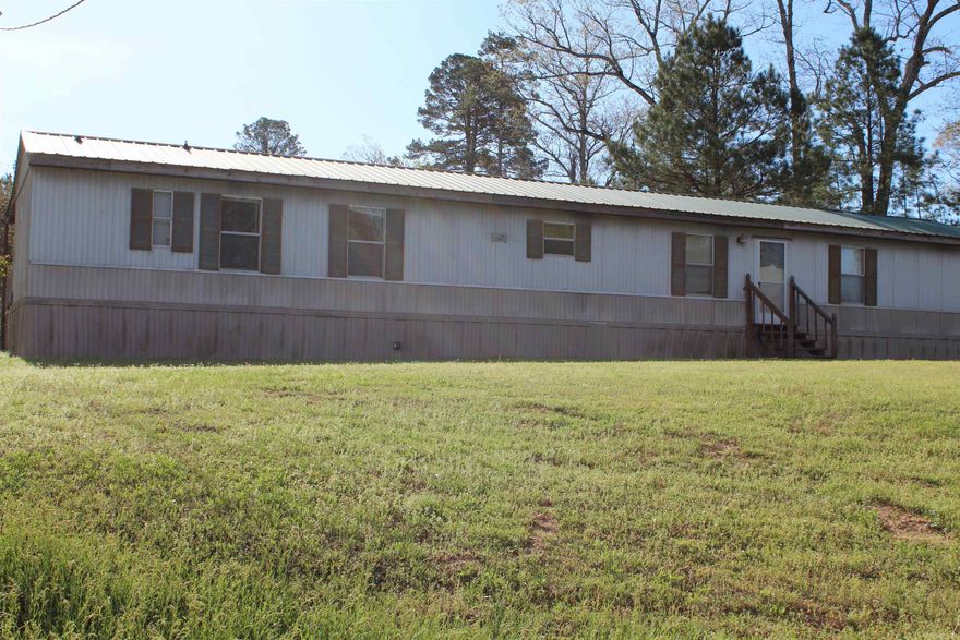 40 ACRES!!! BRING YOUR HORSES, COWS, PIGS CHICKENS BRING IT ALL ** CROSS FENCED ** CREEK RUNS THROUGH THE PROPERTY ** SMALL BARN ***NICE SHOP *** BIG DECK ON BACK OF HOME ** PART OF 40 ACRES IS IN FLOOD PLAIN *** HAVE FULL SURVEY ON FILE ***