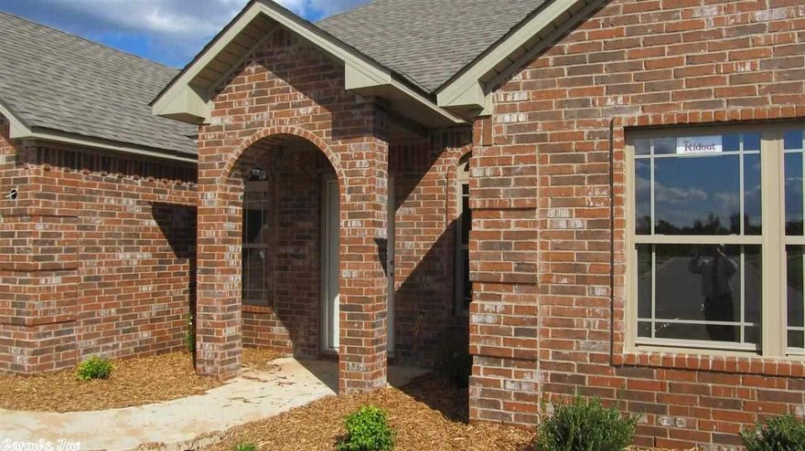 4 Sides Brick; architetural shingle; covered patio 10 x 12; jetted tub;  recessed lighting; stainless steel appliances; granite; ceramic tile in wet areas; handscraped hardwood;