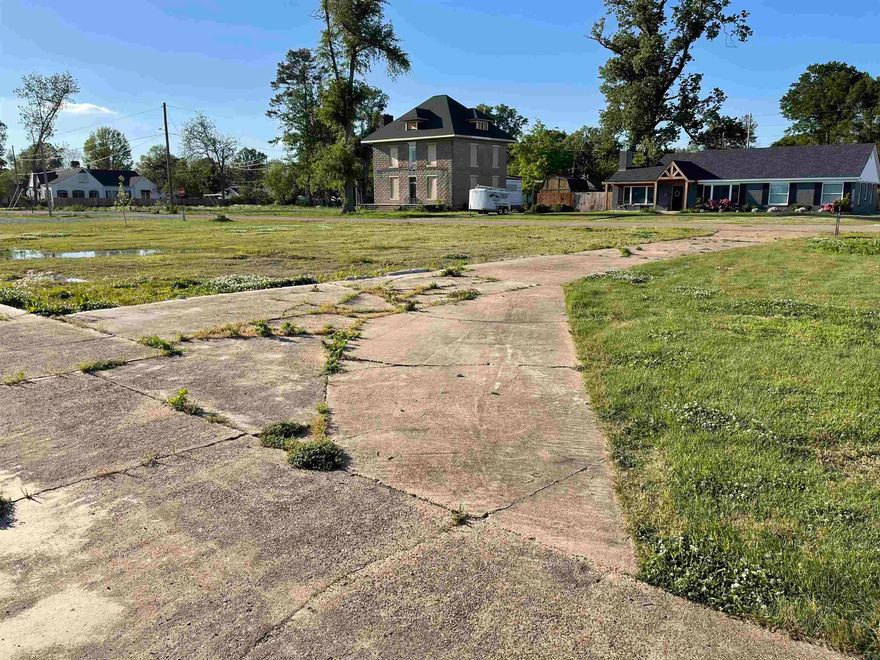 Perfect lot to build your dream home. Great pool that has a shallow and a deep end, corner lot, and nice size storage building. Call today