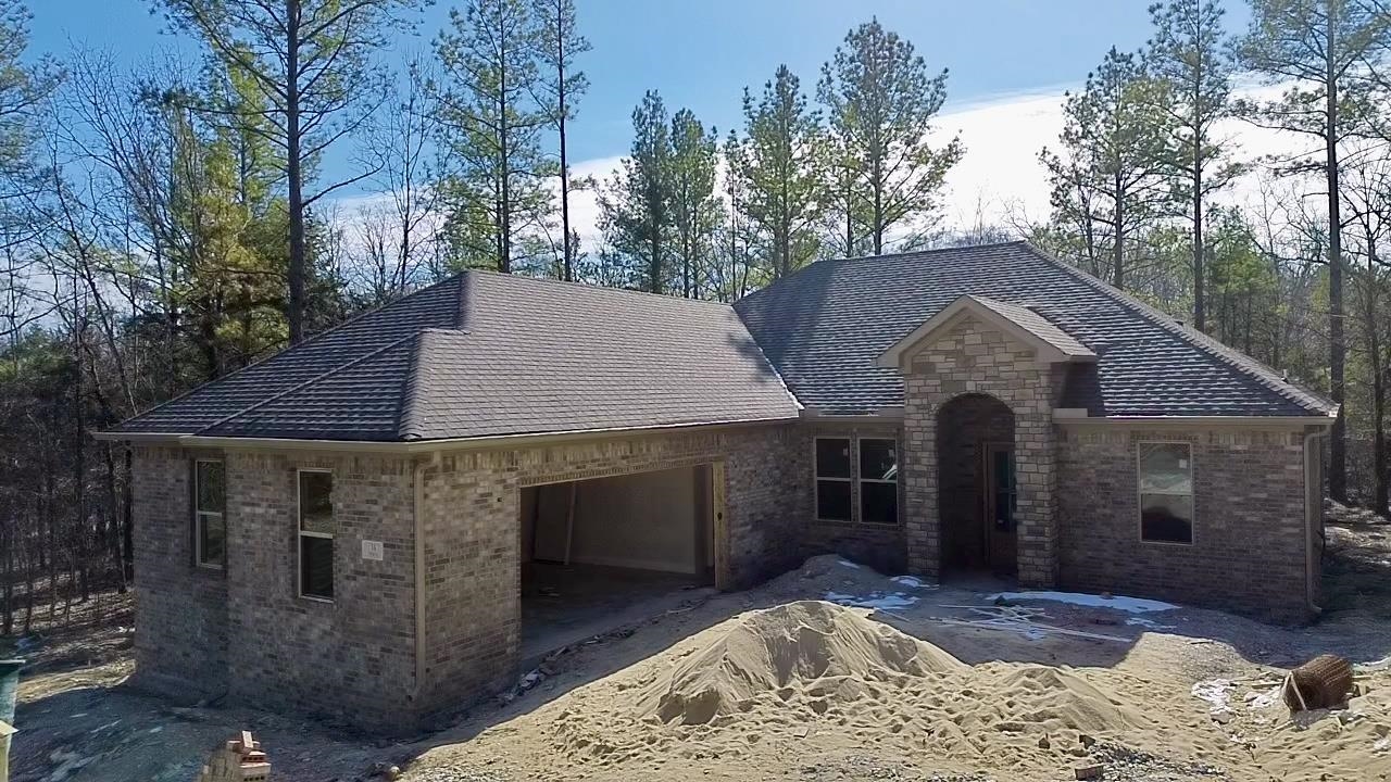 Welcome to your dream home! This stunning new construction features 3 spacious bedrooms, 2 full bathrooms, and a convenient half bath, all thoughtfully designed with modern living in mind. Step into the open-concept living area with soaring 10-foot ceilings that create a bright and airy atmosphere. The chef’s kitchen is a showstopper, equipped with sleek Frigidaire Gallery appliances and ample counter space, making it perfect for entertaining or everyday cooking. The primary suite offers a tranquil retreat with a spa-like ensuite bathroom, while the additional bedrooms provide flexibility for guests, a home office, or family. Situated on a large lot, this home offers plenty of outdoor space to customize for recreation or relaxation. The 2-car garage provides ample storage and parking. Plus, enjoy the peace of mind of a 1-year builder warranty. Located within walking distance to the serene shores of Lake Isabella, you’ll have endless opportunities for outdoor adventures and leisure. Don’t miss the chance to make this beautiful home yours—schedule a showing today!