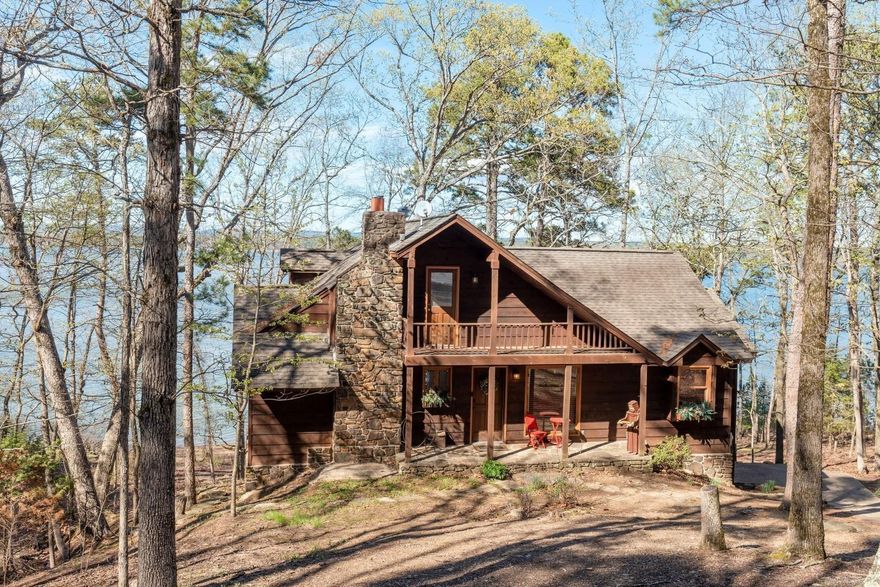 LAKEFRONT FURNISHED HOME with GREAT VIEWS and easy access to the water!!!  4-bedrooms, 4-full baths, 2-living areas, great cabin feel with wood floors and ceilings, stainless appliances, wet bar, 2 decks, patio, great picnic area close to the shoreline, beautiful wood and stone exterior, architectural shingle, garage for lake toys and much more!  The white line is "in the water"!!!