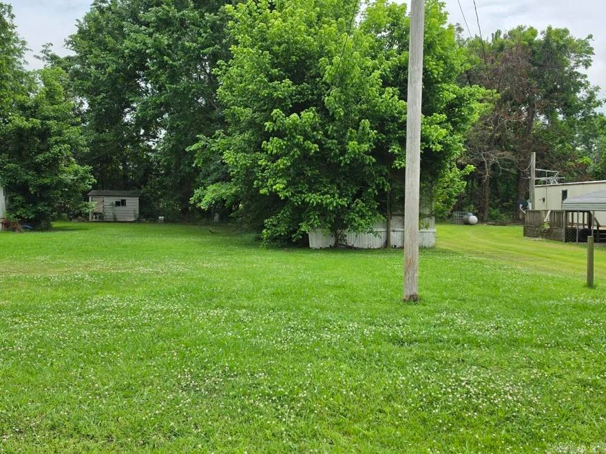 Lot currently has a mobile home that needs to be removed. Utilities are accessible.