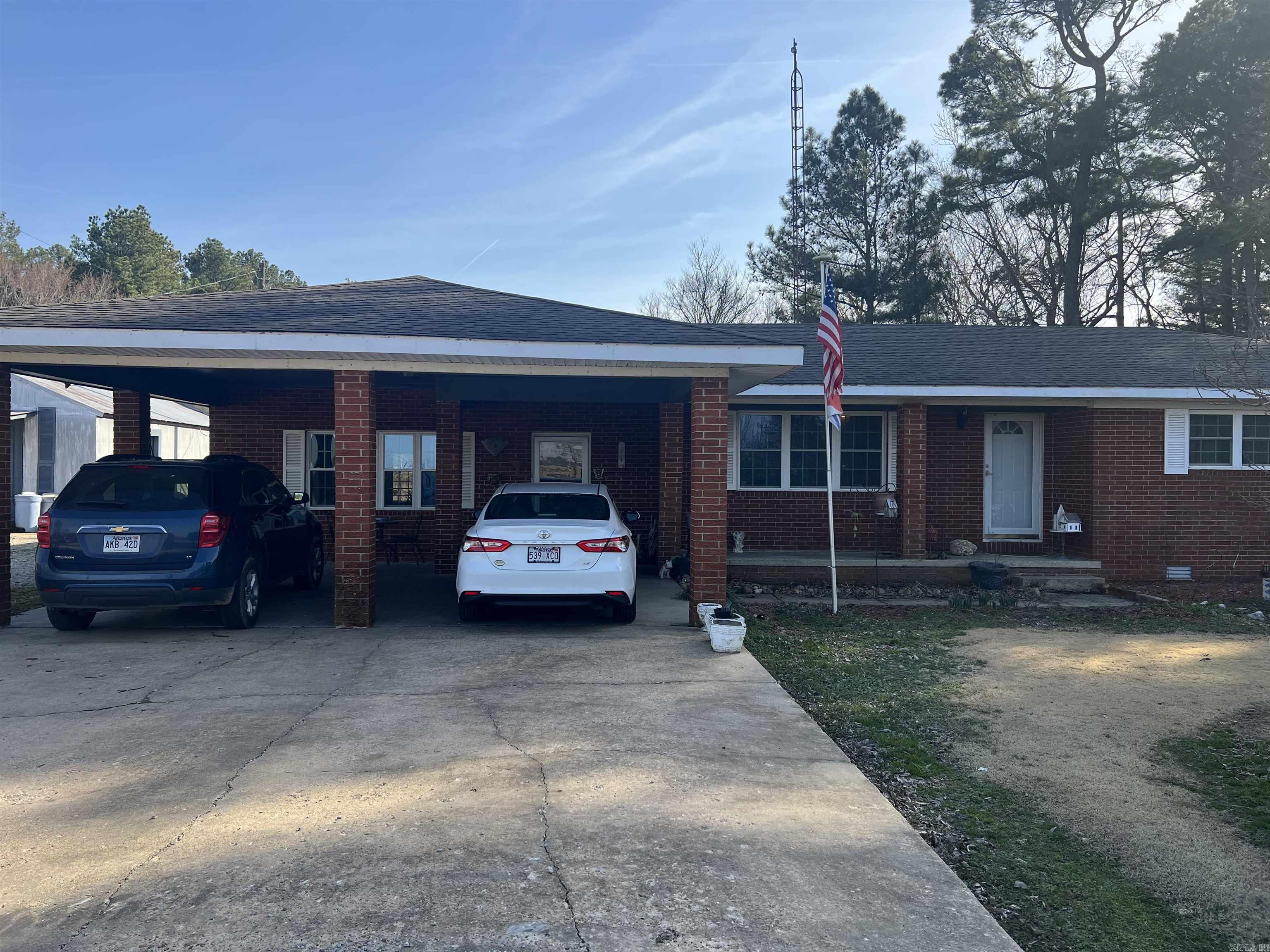 Nice brick ranch home with approximately 5 acres M/L. This home has 3 bedrooms, and 2 baths. Kitchen and bath were both remodeled three years ago. The kitchen has tiled backsplash, new countertops, new cooktop, hood, built in oven, and stainless steel dishwasher. Windows, doors, new lighting , and new carpet have been installed. The roof is approximately 10 years, and HVAC (Trane) is approximately 10 years old, and heat is gas. This home has approx 1807 sq ft and has a large den, and a bonus living room. There is a nice patio area out back which is a great place to entertain and enjoy overlooking the property. A 23 x 36 building with 220/110 electrical is located close to the home. It is an all purpose building. It could be a man-cave, teen-space, or whatever you need it to be. There is a beautiful sycamore tree, and an incredible flowering Japanese tree that is stunning in bloom in the front yard. The property has a stocked pond , several pecan trees, a well, a large barn, and a 9 storage unit building. Enjoy country living on your own private property. Fish anytime in your own private stocked pond! Call today to schedule a time to see this beautiful property!