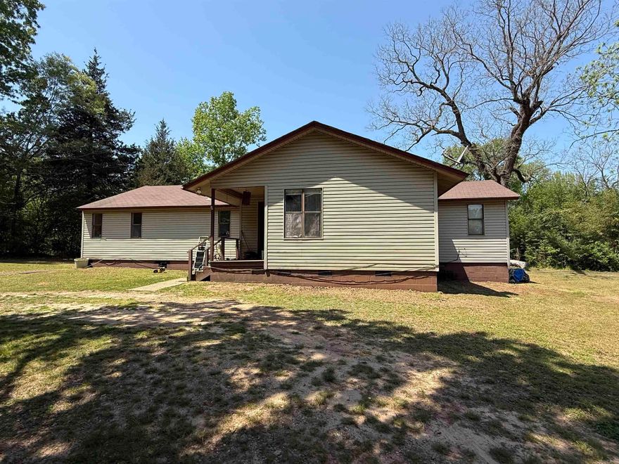 Country living minutes from downtown Lockesburg, property offers 3 bedrooms and 1 full bath with over 1,200 sq ft of living space.  Living room, kitchen with dining area, refrigerator, stove and new dishwasher to convey.  Home is need of a little TLC, great starter home or investment property.  Property also offers a large laundry room, new hot water heater, covered porches, and a 20x24 garage/barn.  Property is on rural water, has well water, electricity and fiber optic internet.  Contact our office for all the details, or to schedule a showing.