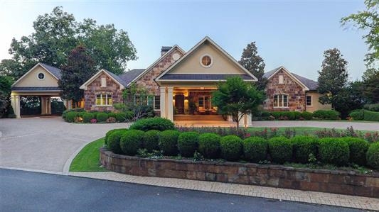 This home is truly a must see! Located on the main channel of beautiful Lake Hamilton, this five bedroom, five and a half bath house has everything you're wanting and more! With over 6000 square feet, some of the features include a gourmet chef's kitchen, over 150 feet of Lake Hamilton frontage, heated swimming pool, fixed two stall covered boat dock, and too many more to list! Please call for your private showing today.