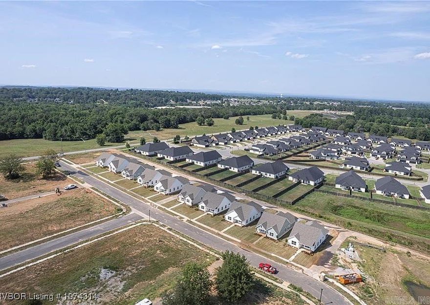 Lot 46 Wells Lake Cottages at Chaffee Crossing in Fort Smith, Arkansas, offers a unique opportunity to build your dream cottage-style home in a thoughtfully planned community. Located near the intersection of Wells Lake Road and Roberts Boulevard, this subdivision is part of the larger Chaffee Crossing redevelopment, known for its blend of residential, commercial, and recreational spaces.