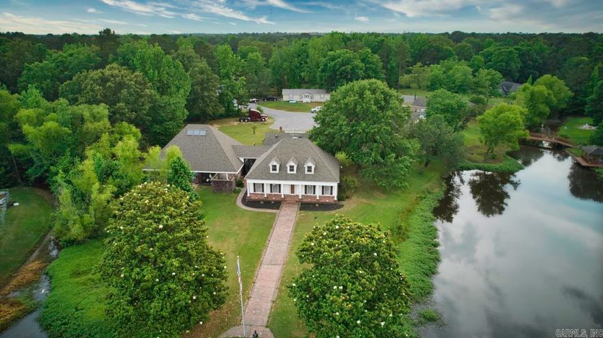 Beautiful lakehouse with 1.36 acres on Lake Orchard! 2600 sq.ft. natatorium with an enclosed inground pool with full bath! Tons of updates - a New Goodman HVAC, 2 New Daiken mini splits (18,000 BTU), New tankless hot water heater, New pool liner & pool pump, updated electrical, breaker box & grounding, replaced areas of copper plumbing to pex & 5 new LED light fixtures! New Roof in 2020! Expansive outdoor area perfect for hosting family & friends! Spacious living area with a cozy wood-burning fireplace. Large Master suite on the main level with double vanities, a huge walk-in closet, jetted tub & walk-in shower. Large kitchen with tons of cabinet & counter space, an amazing pull-out cabinet pantry, an eat-in kitchen area, bar & separate dining area. 2 bedrooms, a bonus & full bath upstairs. Large 4th bedroom or man cave above the garage with a 1/2 bath. Tons of storage space with huge closets throughout! Large sunroom with tons of natural light! Nice side yard perfect for the dogs! Beautiful brick patios & walkways!. Only 15 minutes to Little Rock for an easy commute!