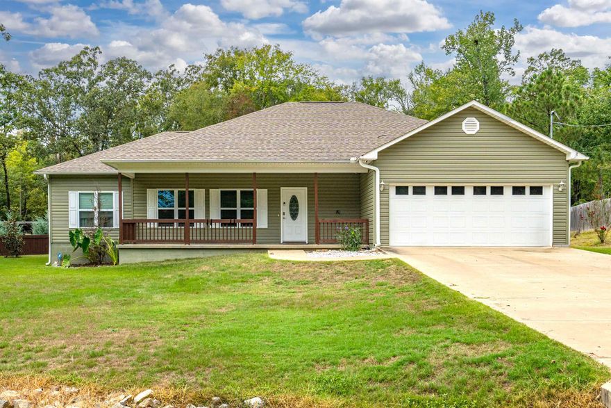 Discover this beautiful home situated on 1.54 acres within the Lake Hamilton School District. This property boasts elegant granite countertops in the kitchen and bathrooms, durable solid surface flooring throughout, and a stunning outdoor kitchen area with a wood-burning fireplace—perfect for entertaining family and friends. Enjoy the 15x8 swim spa just outside your back door and a spacious 20x20 workshop with electricity. The fully fenced backyard includes an 18x36 concrete dog run or kennel, versatile enough for various animals. Immaculately maintained and conveniently close to Lake Hamilton School, this home is a true gem.