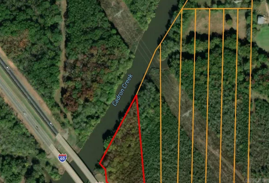 Unrestricted 3.65 acre lot. Suitable for a home, manufactured home, or livestock. All timber. 4 miles from Conway.