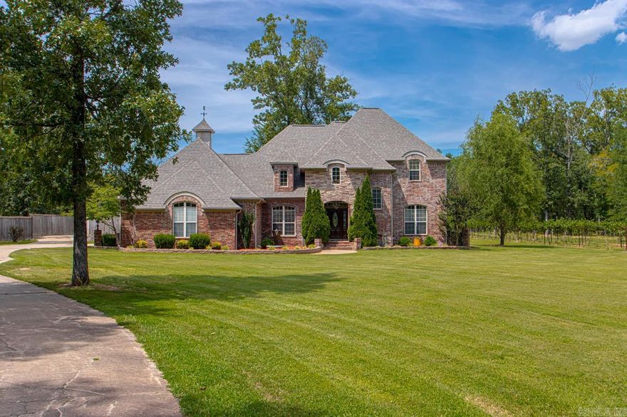 Dreams really do come true! Come see this custom "smart" home perfectly positioned on 3 beautiful acres! Enter into your new home to find a stunning two story foyer! Family room w/fireplace! Large dining room! Chef's dream kitchen! New Bosch dishwasher! New granite! Enough room for all the chefs in the family! Large Island! Double ovens! Etc! Etc! Master down! w/wonderful spa bath! Guest room w/en suite also down! Up~3 big bdrms or 2 w/bonus room! 3 car garage w/ 8X8 safe room! Over sized laundry room! Wait until you see the outdoor kitchen w/every single bell and whistle you have ever dreamed of! Big Crackerbarrel fireplace! Oh my!  Wait there is more... 20X40 inground pool w/slide! New liner! Outdoor shower! Wait there is more... 28 X 32 Bricked shop, heated & cooled! Finished out w/knotty pine walls! Floored attic above for storage! Separate driveway leads to shop! Wait there is more!! How about a Vineyard? A vineyard full of Petit Manseng grape vines! FABULOUS! New roofs 2023! New very expensive septic! Sprinkler system run from the well! Gazebo! Fountains! New Paint! On & On & On! Too much to list! You have to see it to believe it! Dreams really do come true!