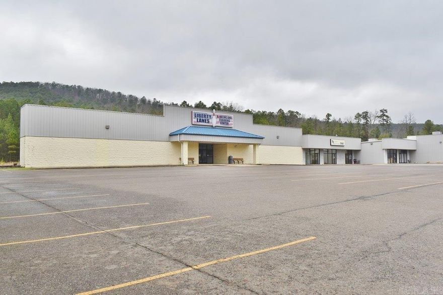 High visibility location in a high traffic area on N. Hwy 7, this is only 1+ mile from Hot Springs Village entrance and close to Walmart, gas stations and other shopping areas.  It is situated on a large open lot with abundant parking space, in the middle of Bowling Alley on the left and Restore on the right. This 3,600sf space have been divided into 2 individual units with 2 store front entrances in Unit A and 1 store front entrance in Unit B.  Can easily run a business in one unit and lease out the other unit to cover mortgage payments and expenses for the whole building.  Unit A has 2 Lobby areas, 5 offices, large storage & utility rooms and rest room.  Unit B has store-front lobby, office, sitting Room, kitchen room and 3 restrooms. Both units have their own front and back entrances and HVAC thermostats.  Come check out this investment opportunity at an affordable price.