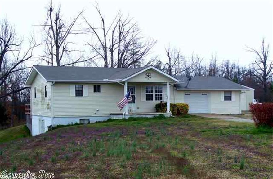 Nice house in a country setting on paved Highway. 2 bedroom upstairs, 2 bedroom downstairs and a living space on both levels. Deck off of the kitchen, nice shop with electricity and concrete floor and overhead door. House sits on 4 acres m/l in the rolling hills between Lafe and Marmaduke. Very peaceful area and open land with a small pond.
