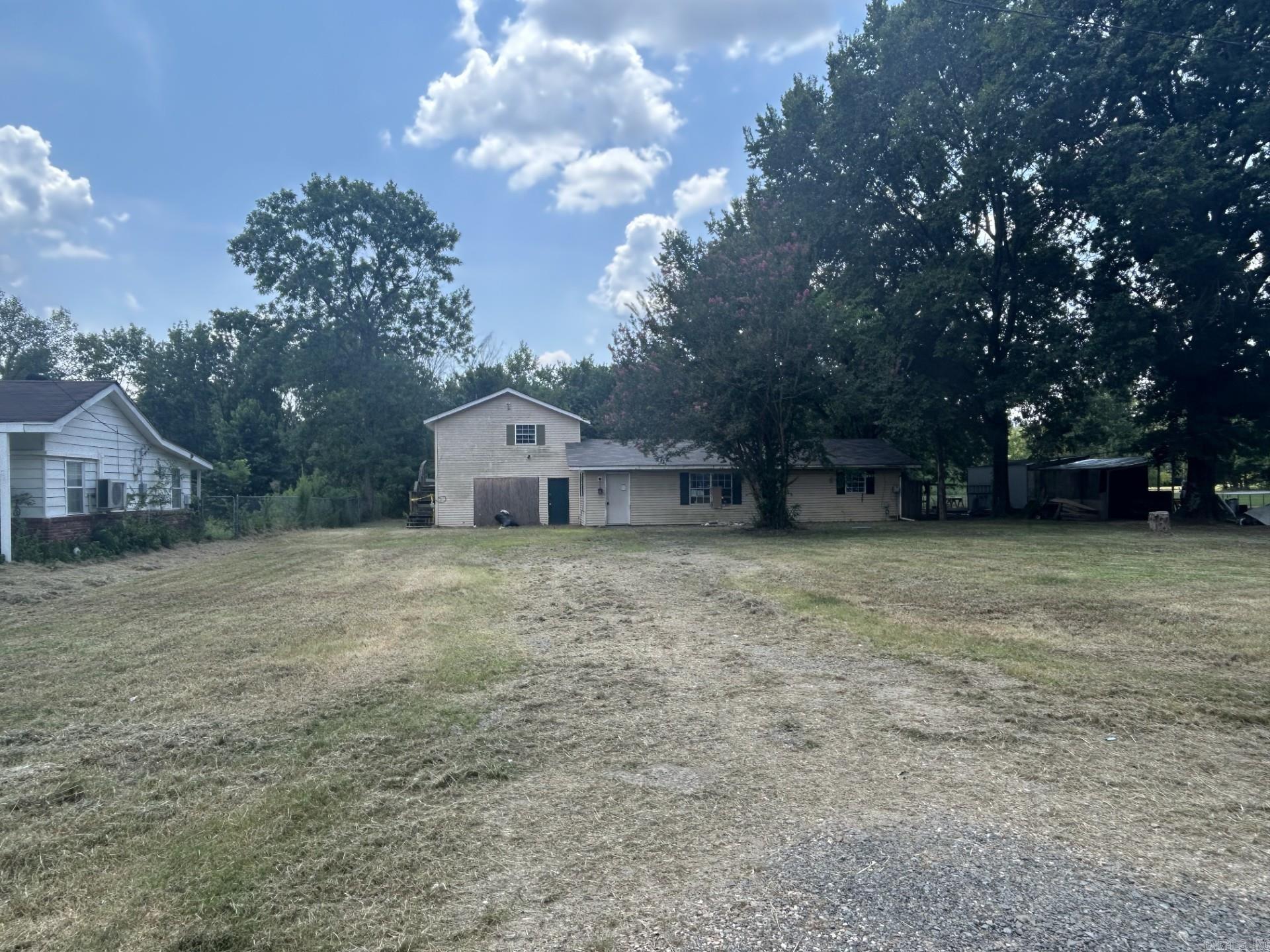 MULTIPLE OFFERS IN...Seller will respond to all offers after 8/11/2025. If your buyer wants in, please encourage them to submit ONLY their HIGHEST AND BEST Offer. Opportunity awaits in this shell of a house. The main house has two bedrooms and two baths, the ADU is a 1 bed/1 bath apartment above the garage. However, there will be no access to the apartment due to a hole in the lading of the decking as well as mold throughout the apartment. The previous owner was in the process of turning the garage into two additional bedrooms. They did not get past the framing. Enter through the front door and straight across into the dining/kitchen combo. To the right of the front door is the living room guest bath, laundry room, primary suite, and bedroom 2. The garage is to the left of the dining/kitchen combo.