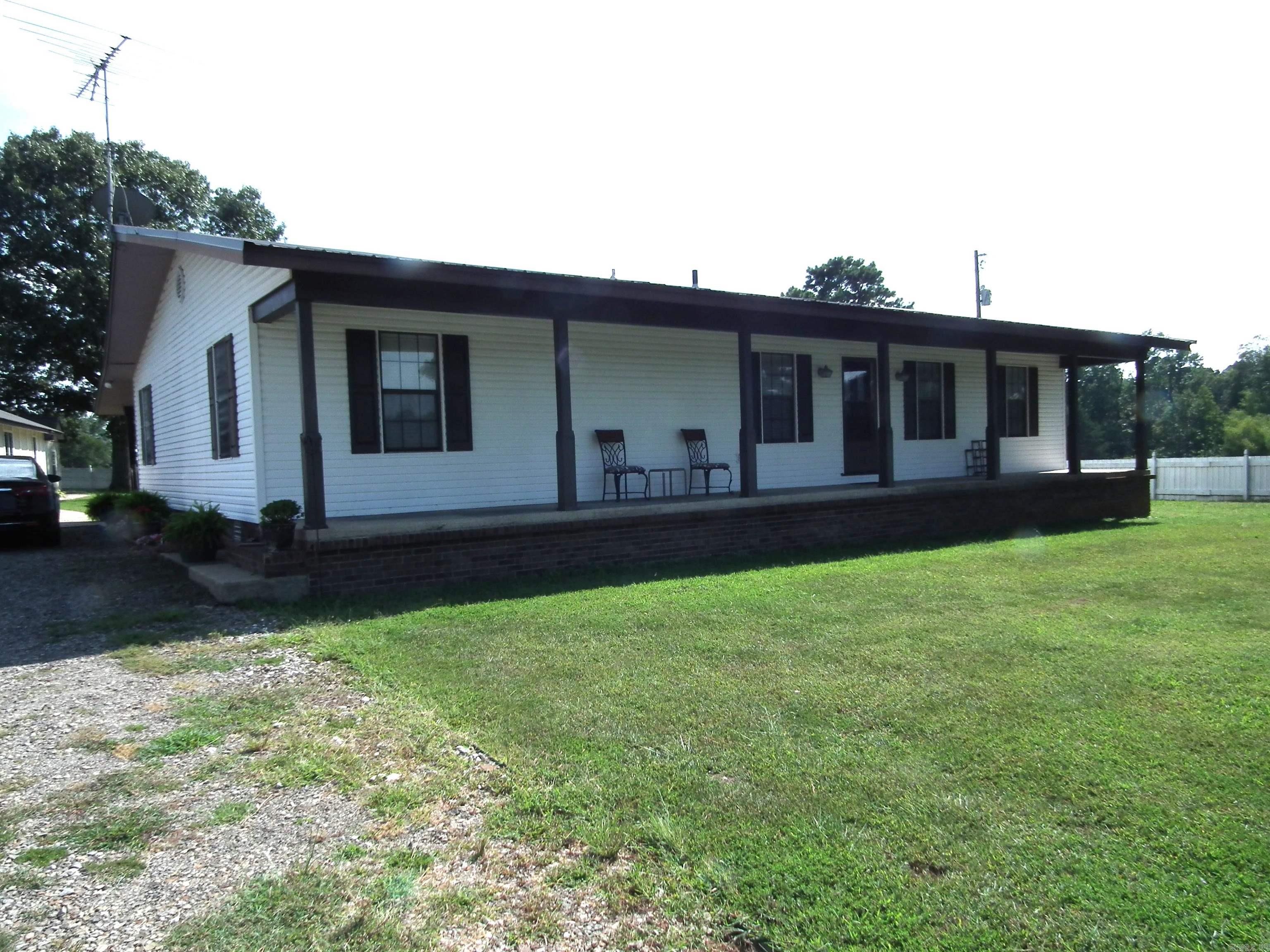 Beautiful home located on 6+ acres. Technically a two master home but the bonus area could be utilized as a third bedroom. Totally rebuilt from mobile home I-beam up in 1984. Vaulted wood ceiling in open kitchen/living/dining area. Office area with fiber for those who work remotely. Glass enclosed porch with hot tub. Huge dry storm cellar. Detached 2 car garage with work area. Work shop/she shed (10x50) with electricity and water. Privacy fenced yard. Barb wire around pasture. Electric gated entry. Please give 24 hour notice for viewing