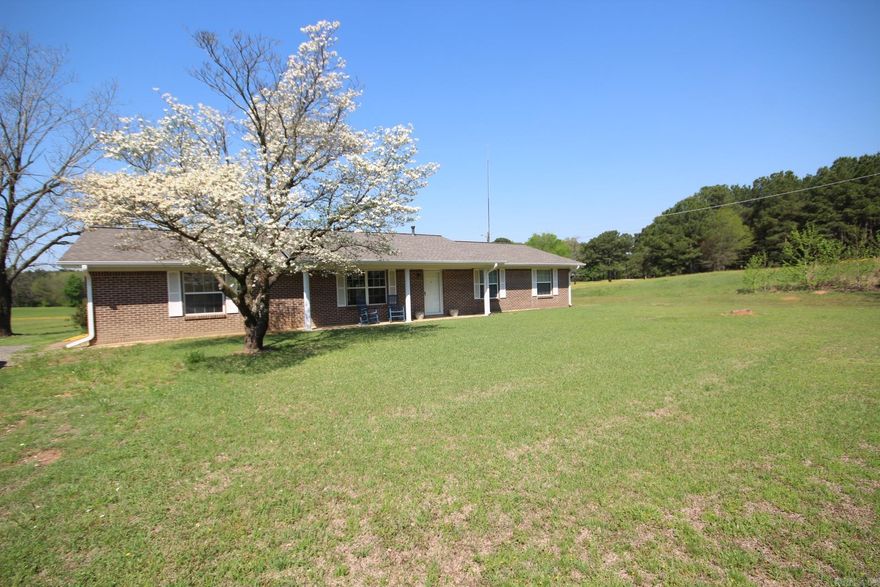 3 bedroom, 2 full baths brick home with approx. 1600 Sq. Ft. of living space situated on approx. 1.42 acres.  Kitchen features a built in wall oven.  Spacious family area.  Enclosed sunroom.  Large utility room.  Covered patio with beautiful views of property.  RANGE/OVEN , REFRIGERATOR CONVEY WITH SELL OF PROPERTY.