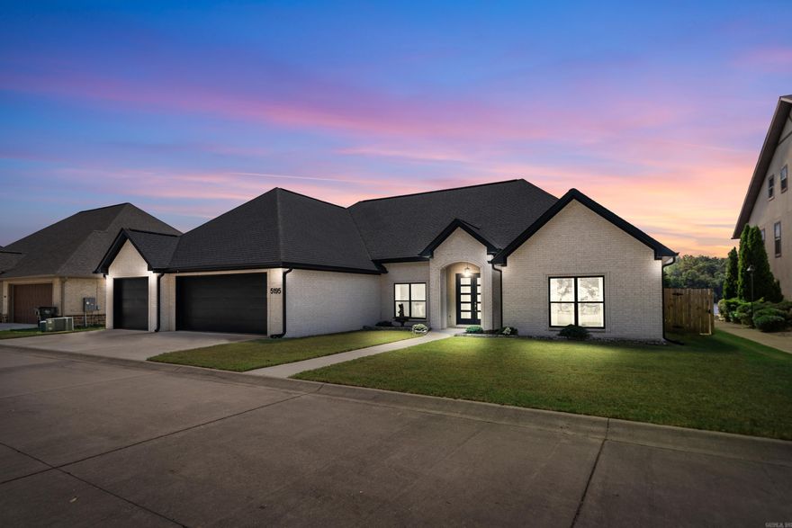 Welcome to your lakeside paradise at Lakeside Gardens! This stunning single-story home boasts 4 bedrooms, 2.5 baths, and 2,861square feet of luxurious living space, nestled on the serene shores of Lake Hamilton. Built in 2020, this modern residence sits on a level lot with 92 feet of prime shoreline, offering breathtaking views of the tranquil waters. The exterior exudes elegance with its one-story white brick facade accented by sleek black trim. Step inside to an airy & open floor plan featuring 10-foot ceilings and exquisite luxury vinyl plank flooring throughout. The large family room is the heart of the home, complete with an electric fireplace and a wall of windows that frame panoramic vistas of the main channel of Lake Hamilton. This inviting space flows into the patio,where you can unwind and entertain while enjoying the lake breeze. The chef-inspired kitchen is a culinary delight, equipped with a convenient island bar, a walk-in pantry, and an adjacent formal dining area. Retreat to the luxurious primary ensuite,featuring a lighted tray ceiling, double walk-in closets, and a spa-like bath with double vanities & walk-in shower. Triple Garage with 1 being extra deep.