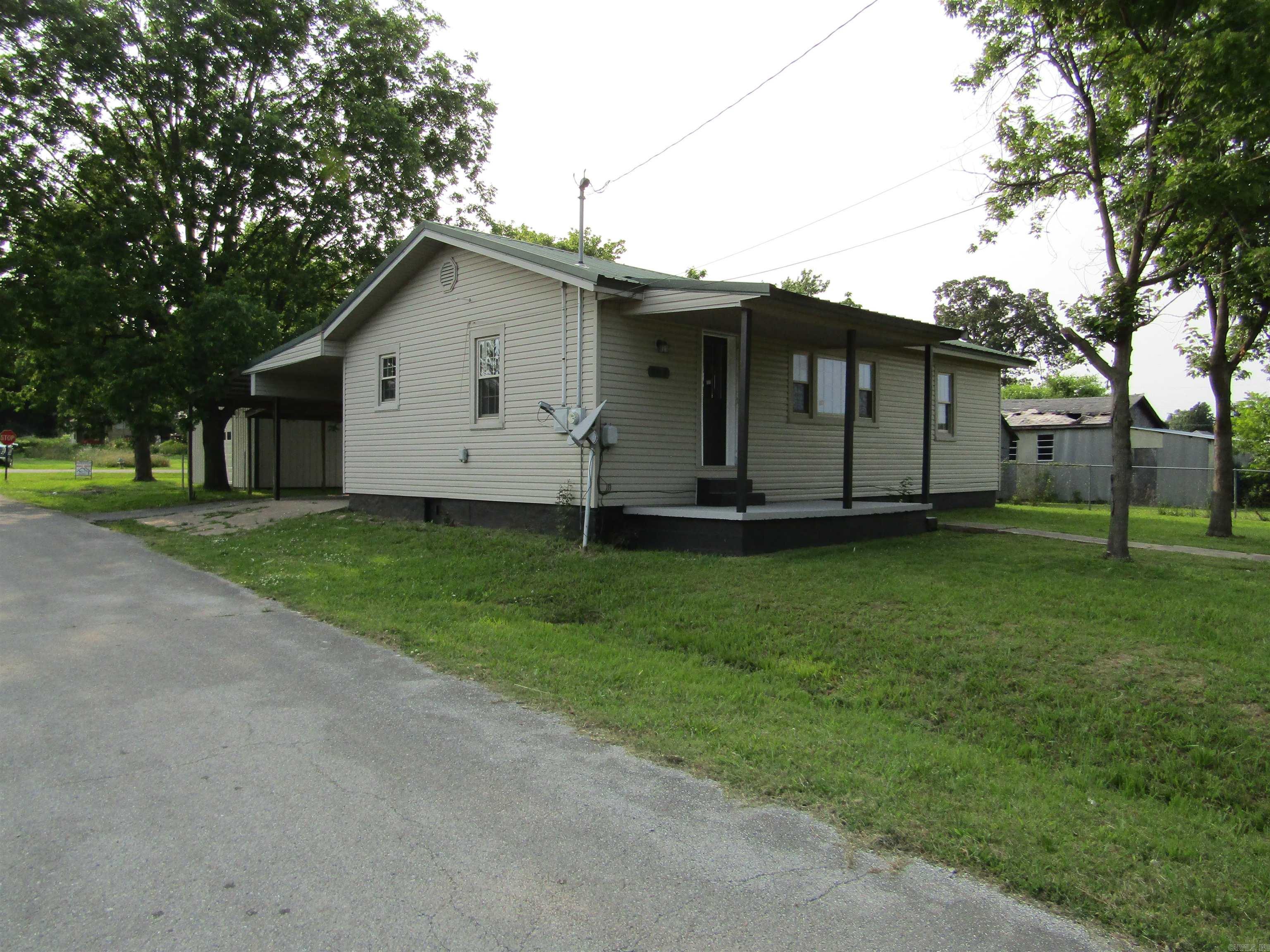 REDUCED!! Just remodeled. Three bedrooms, two baths. New floor covering. All new light fixtures. New ceiling fans. New paint. New quartz countertop. 25 x 30 heated and cooled shop with underground storm shelter. Come see it today before it's gone.