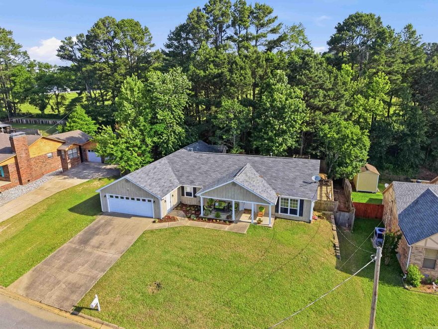 Welcome to 31 Azalea Circle! This spacious 3 bedroom, 2 bathroom home offers 2,294 square feet with a functional layout and plenty of room to spread out. Inside, you’ll find oversized bedrooms with brand new carpet, a separate dining room, and a cozy living room featuring built-ins and skylights that bring in tons of natural light. The kitchen is designed for both everyday living and entertaining with a stand-up bar, large window over the sink, coffee bar area, and not one but TWO pantries for extra storage. Both refrigerators will convey with the home! The oversized primary suite is a true retreat with separate vanities, a soaking tub, walk-in shower, and a large walk-in closet. The garage offers abundant storage space plus an additional separate storage room. Outside, you’ll also find a storage building in the backyard for even more convenience. Enjoy your mornings or evenings relaxing on the inviting front porch complete with a porch swing—perfect for slowing down and enjoying the neighborhood. If you’ve been looking for a home with generous room sizes, great storage, and thoughtful features throughout, this one is a must-see!