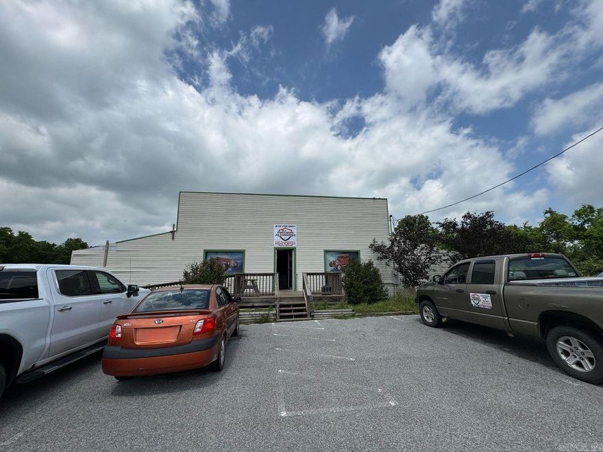 1 bed 1 bath multi purpose building is in a great location on major road across from the Sharp Co Courthouse. Building is handicap accessible and has 5772 sq ft and includes living quarters. City zoning will need updated. Heated and cooled showroom/workshop with 2 overhead doors. Also featured is a separate workroom with car lift which is included, could be good rental income.