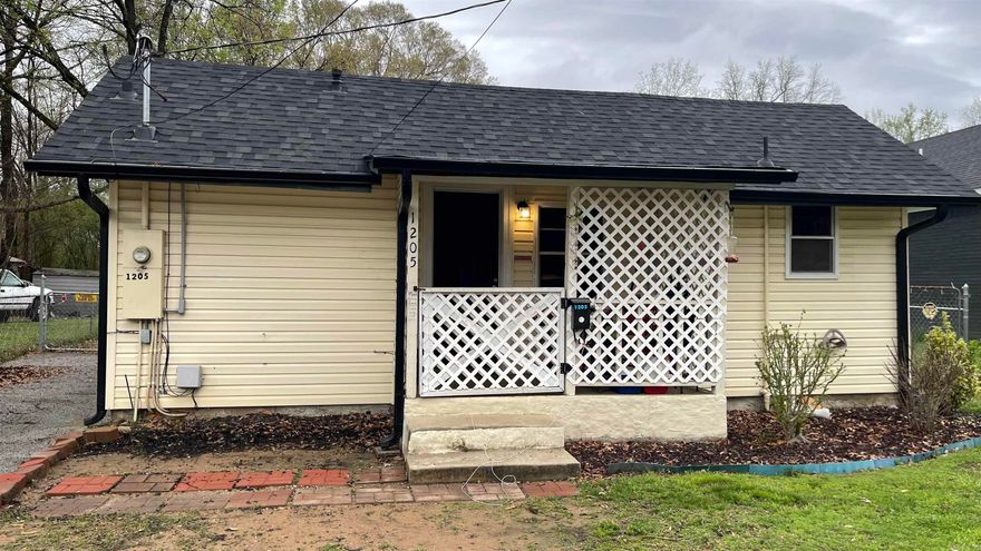 This charming 2 bedroom 1 bath home has a large  fenced back yard with a slab poured that could be used to start a garage or shop building.  Since 2022, the seller has had a new roof installed on the back of the house, fresh paint on walls, new vinyl plank flooring, stainless steel sink and new electric stove installed in kitchen, water heater, window screens, vapor barrier under house, 18 inches of attic insulation, and gutters installed.  The main updates have been done.  It's just waiting for your personal touches!  (Please note that seller's dog will probably be in house.  He is friendly but he may jump on you.  Just tell her to sit.)