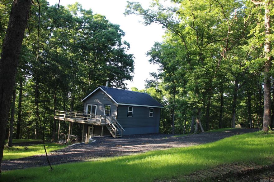 Looking for a cabin in the woods, this one meets all the criteria. Very private setting with 6.49 acres newly built in 2020. This home has a walk-out basement with a bedroom in basement (this bedroom has no windows). Large mud room and utility room with plenty of storage. Main level has open floor plan with vaulted ceilings and another “bedroom” (this one has windows but no closet). Wood stove in living room and baseboard heat in basement and upstairs. Window unit for cooling. Loft area on main level for additional storage. Outside you can have a few chickens with the already in place chicken house, needs fencing. Sit on the deck and take in the serenity or take a short walk only .7 of a mile to Tomahawk Creek slab for a swim. This home is in St. Joe but is only 3.5 miles to the town of Gilbert and the Buffalo National River put in, where you can fish, canoe or swim.