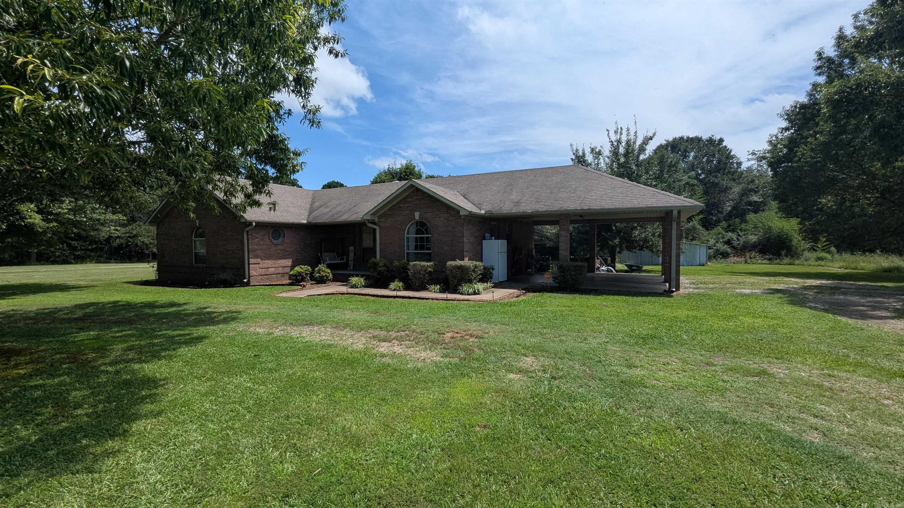 Welcome to your peaceful slice of Arkansas! This charming 3-bedroom, 2-bath home sits on a scenic 2-acre lot in White County, offering a perfect blend of modern updates and country charm. With over 1,600 square feet of living space, this property is designed for comfort, function, and relaxation. Step inside and discover a spacious living room featuring a custom octagonal tray ceiling with a vaulted center ā truly a showstopper! The primary suite is your personal retreat, complete with a walk-in closet, a luxurious jet/soaker tub, and a separate walk-in shower. You'll appreciate the well-maintained laminate flooring throughout the main areas. Major updates include a roof replaced in 2015 and an HVAC system updated in 2020, ensuring peace of mind. Outside, the beautiful open yard invites endless possibilities, from gardening to entertaining, with ample space to roam. A convenient 2-car carport adds to the functionality of this charming home. Don't miss the chance to experience the best of Bradford living!