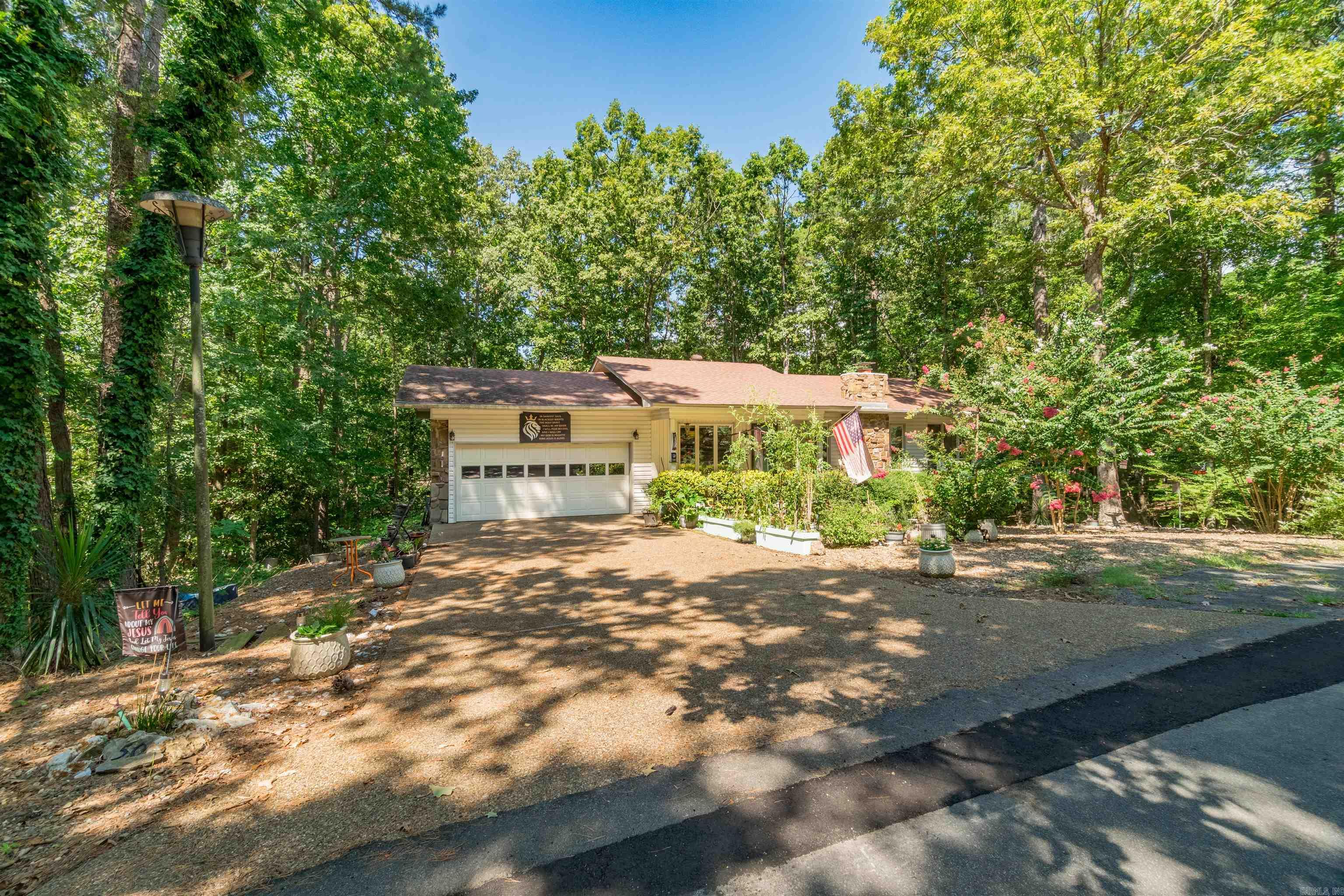 Move in Ready! This 3 bedroom 2 1/2 bath home has many improvements. New heat pump, April 2024. Whole home Generac Generator October 2023, transferrable warranty. Upstairs flooring and window shades 2023. Many water lines replaced. Main water line to house replaced 2023. Downstairs bath remodel 2022 by Bathfitters, transferrable warranty. Garage door 2020. Fireplace cleaned 2024. Driveway, porch and stone on house sealed 2025. Roof 2018. 28 x 12 heated and cooled workshop (included in square footage) Wood burning fireplace with blowers. 8 x 19 screen porch AND 8 x 10 open deck.