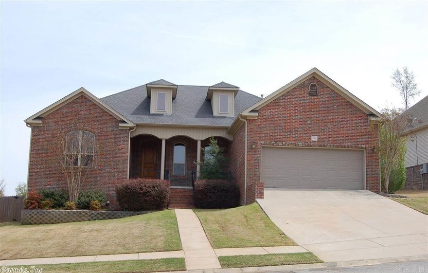 Beautiful home w/ tall wood entry door & inviting front porch. Inside see custom wood trim, columns, wall sconces in dining rm, mantels over windows & entry door, 10' ceilings in common areas pan up to 11' in living rm, 9' ceiling in rest of house. Hardwood floors in entry, dining & living rooms, tile in wet areas. Custom wood cabinets, granite. Masterbath has whirlpool & separate shower,double vanities, covered back porch, walk-in storage under house.Great neighborhood! $1K Flooring allowance