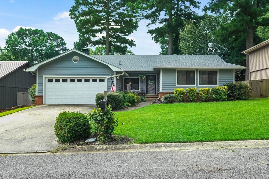 Cute! Cute! Cute! This Maumelle home is located on a quiet cul de sac and is ready for you to move in! Enter into this precious home and fall in love with the open floor plan. The living room, dining room and kitchen are open to each other for great entertaining space. The living room features a vaulted ceiling and a wood burning fireplace with gas starter and brick surround. The kitchen boasts lots of counter space along with a new dishwasher in '22, electric stove, and refrigerator that will stay. Off the living room is a heated and cooled sunroom. Laminate flooring flows seamlessly through these areas. The primary suite is extra large with an ensuite bathroom that includes a vanity with sitting space, a tile shower and a walk in closet. The two guest bedrooms are of ample size and share a hall bath that has an updated tub/shower with tile surround. The exterior is painted cedar and has guttering. There is a covered patio for fun outdoor entertaining. There is a storage building in the fully fenced backyard. Garage door and Roof new in 2024. Agents see remarks.